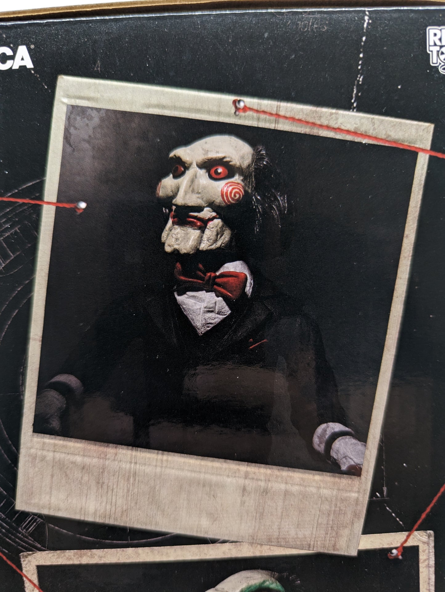 NECA - SAW Billy The Puppet with Tricycle 12 inches.